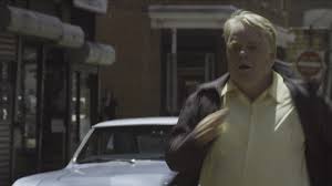 Philip Seymour Hoffman, in his final role, plays conman Mickey Scarpato in the drama 'God's Pocket.'